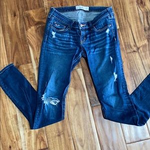 Distressed dark jeans